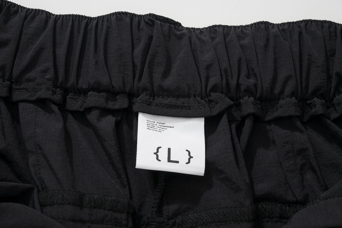 AMULET PATCHWORK POCKETS SHORTS BLACK