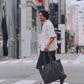 AMULET washed tote bag in grey, carried on street